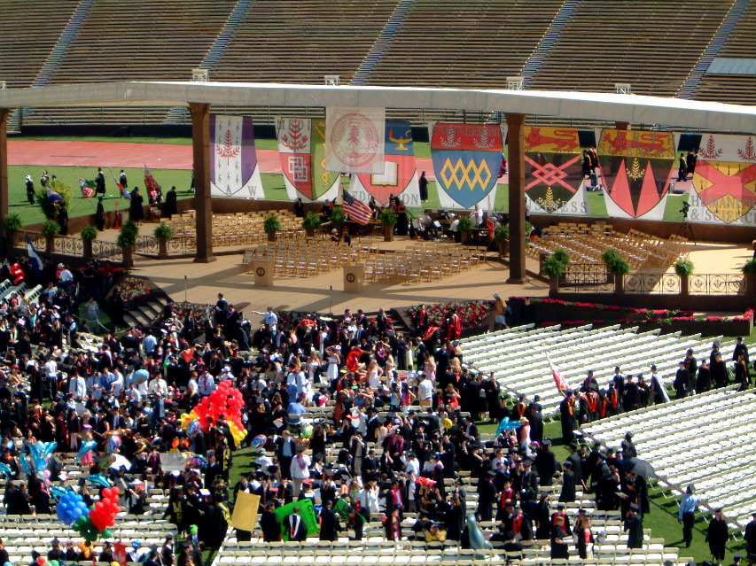 The school flags hang over the stage