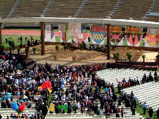 The school flags hang over the stage