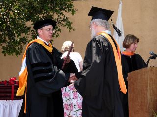 Receiving the diploma from the CS Dept Chair